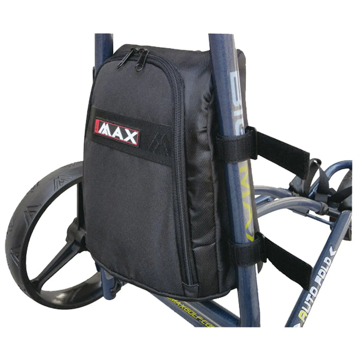 A black backpack is attached to a wheeled frame with adjustable straps and sits beside a large black wheel in a functional outdoor setting. The backpack appears organized for storage.