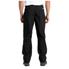 Black pants are worn by a person standing straight with hands at their sides in a neutral indoor setting, emphasizing a simple and functional style suitable for various activities.