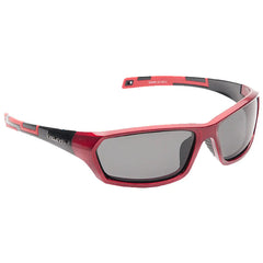 Red sunglasses with dark lenses rest at an angle showing their sleek design and curved frames while the background is a plain white surface highlighting their sporty appearance.