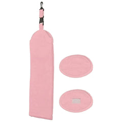 A pink cleaning cloth with a looped handle is positioned vertically alongside two oval cleaning pads on a plain background, suggesting a cleaning or polishing use in household tasks.