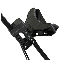 A black and gray adjustable strap securely holds a harness on a metallic frame with bolts and screws visible, indicating a sturdy construction likely used for supportive or recreational purposes.