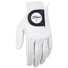A white golf glove rests with fingers slightly spread showcasing a leather texture and ventilation holes featuring a black patch with the Titleist logo and number 1 on the wrist area.