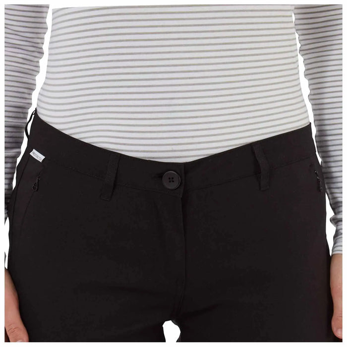 A person is wearing a fitted striped long-sleeve top and black pants featuring a button closure and side pockets against a plain background.