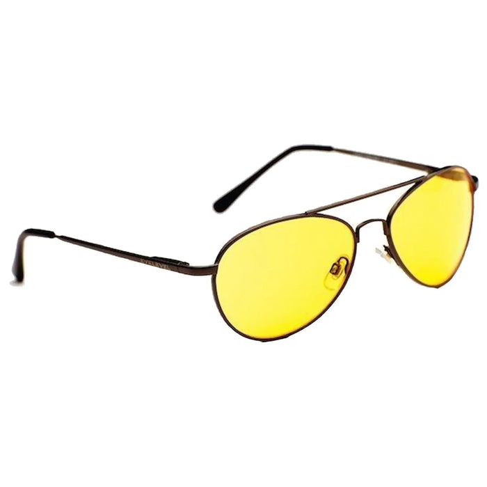 A pair of yellow-tinted sunglasses rests on a flat surface with brown metal frames highlighting their oval shape and slender arms designed for wearing while protecting eyes from bright light.
