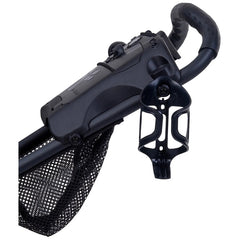 A black stroller handle is visible featuring a storage net underneath and a cup holder attached to the side designed for carrying beverages while strolling through various environments.
