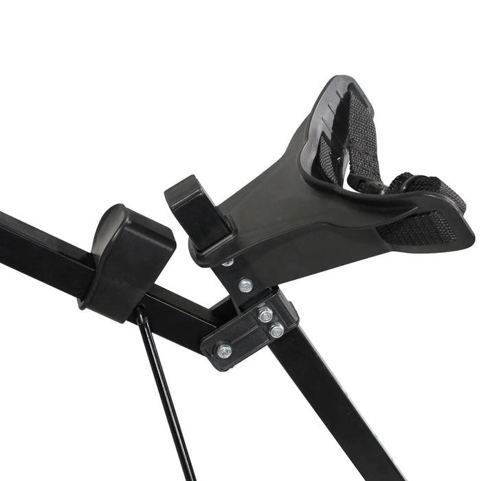 A black adjustable seat support with a padded shoulder strap is positioned at an angle on a metal frame designed for secure seating in a fitness or recreational context.