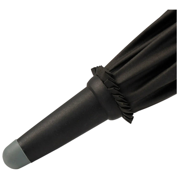 A black umbrella is partially closed with its fabric gathered and the handle pointing downwards against a plain white background, indicating it's momentarily not in use.