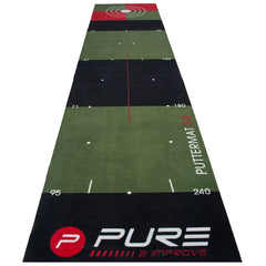 A long green putting mat is laid out with distance markers and targets at the far end showing a concentric circle design indicating practice areas for golf putting skills.