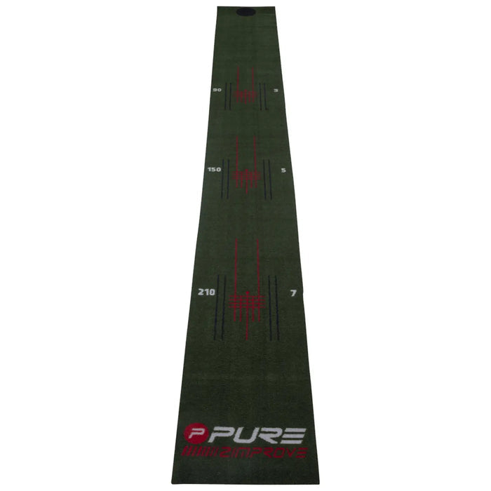 A long green mat designed for practice features markings for distances 90 150 and 210 with additional indicators for improving skills and a logo at the bottom reading PURE.