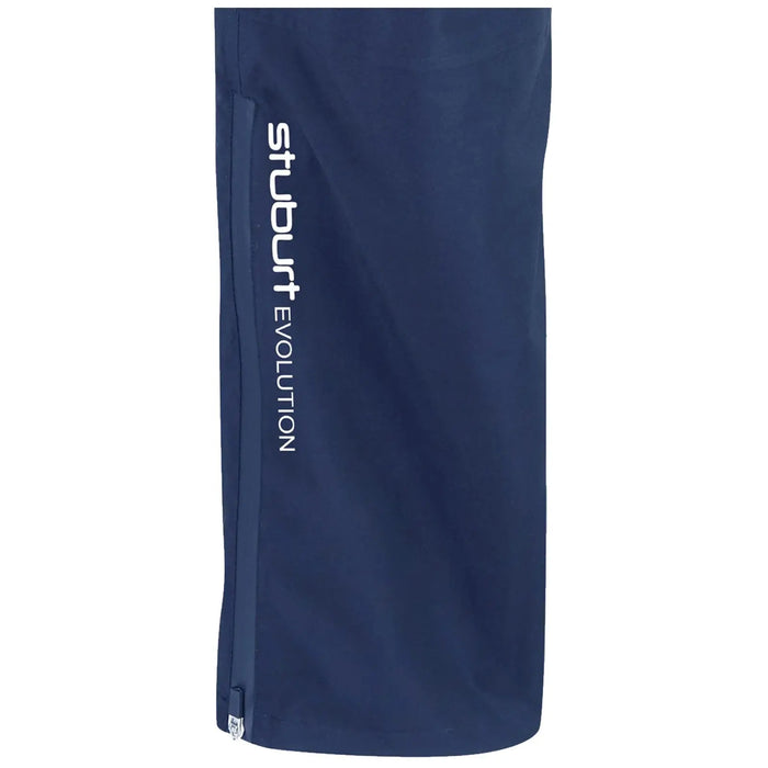 A navy-blue sports garment stands upright featuring a zipper on one side and the text "stuburt EVOLUTION" printed in white along the length, suggesting a stylish, athletic design.