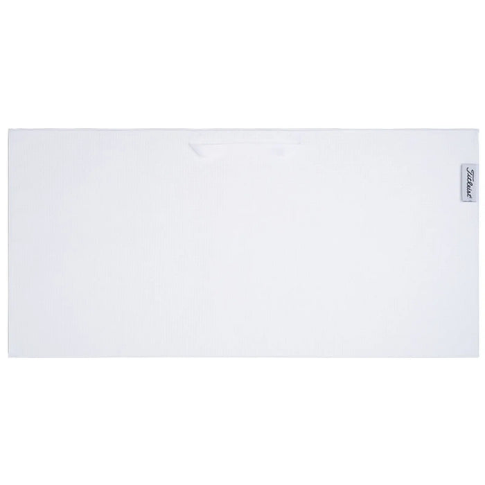 A rectangular white towel lies flat on a surface designed for drying or cleaning use with a small handle on one side for easy transport.
